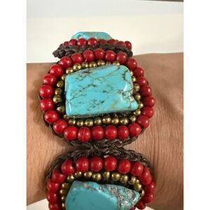 Howlite turquoise surrounded by red and gold beads